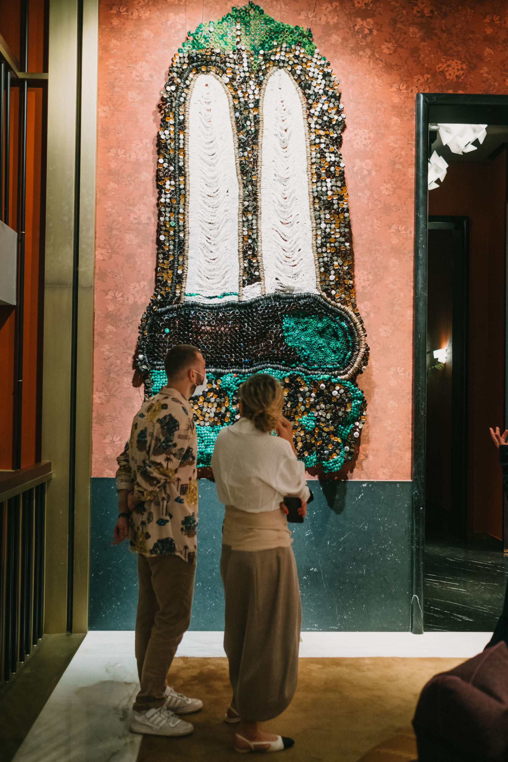 Two people observing exhibition